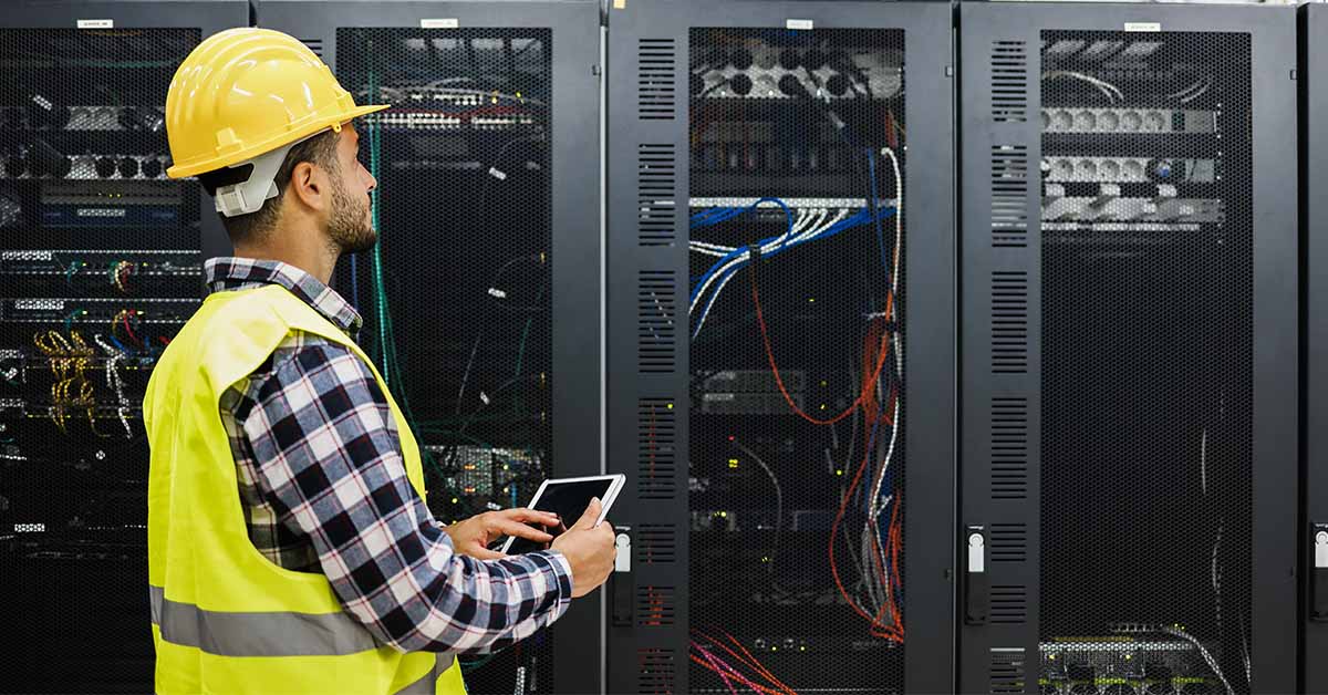 worker inspecting a server