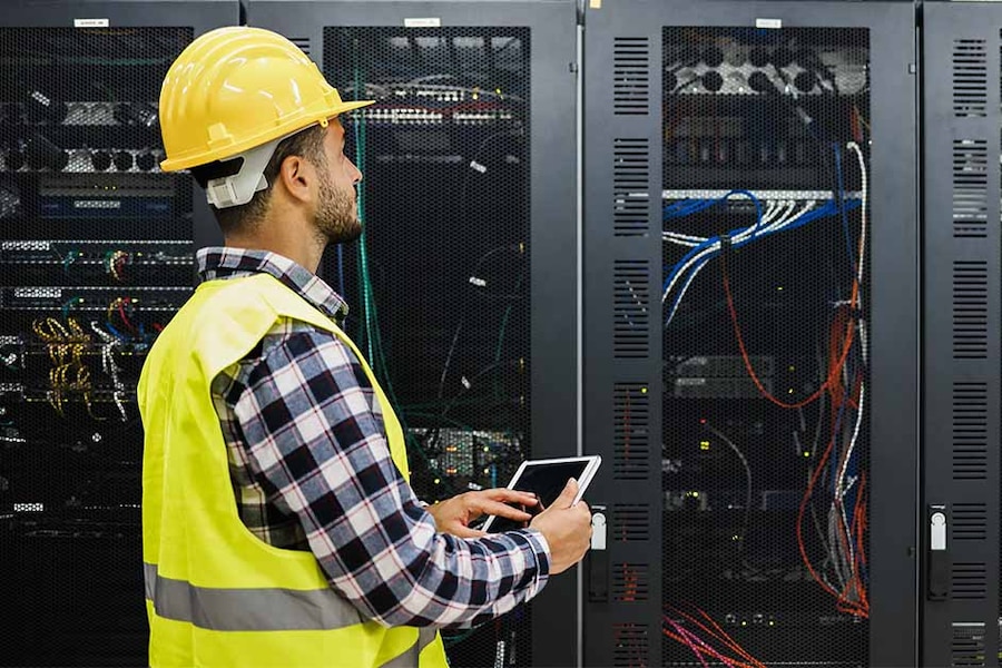 worker inspecting a server