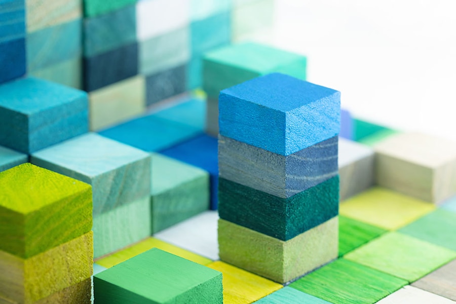 Image of stacked, multi-colored wood blocks.