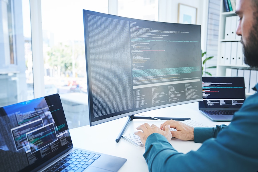 man at a desk working on a computer