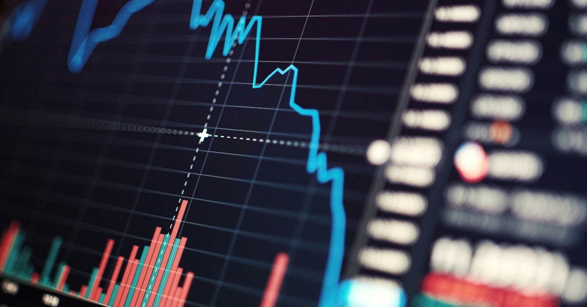 A chart showing a falling blue line, representing falling stock prices during a recession.