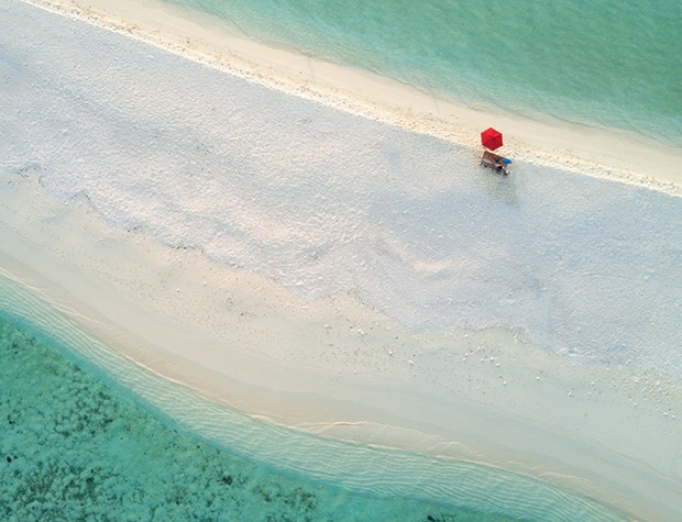 Red umbrella on a beach