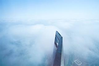 skyscraper piercing clouds