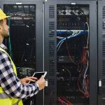 worker inspecting a server