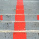 image of concrete stairs with a painted dividing line and up and down arrows.