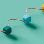 Three colorful interlocked cubes