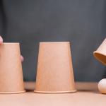 Image of a "shell game: with ball and cups