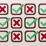 patchwork of x markings and checkmarks