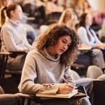 Photo of college student in a classroom